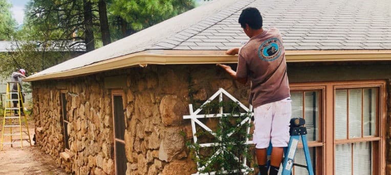 ACME Gutter Co. crew installing rain gutters in Flagstaff, AZ
